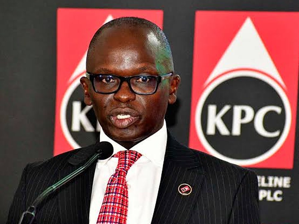 KPC acting managing director Pius Mwendwa speaking at a podium in front of KPC logos